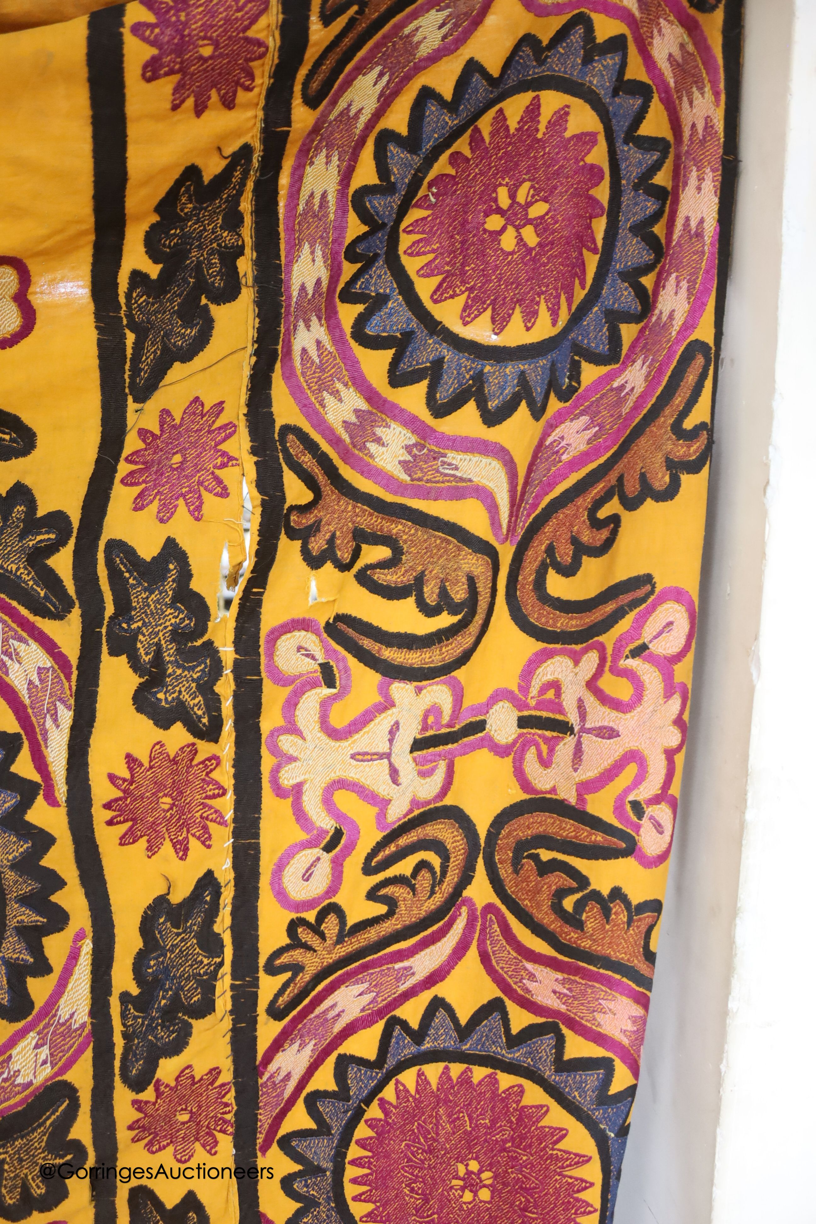 An orange ground Suzani prayer arch, circa mid to late 19th century, length 240cm width 166cm